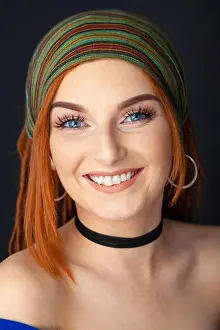 Redhead Prints: Portrait of a beautiful red headed woman with dreadlocks and wearing a head scarf