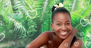 Femininity Prints: Portrait of beautiful relaxed black women smiling at spa with an orchid flower in the hair for st va
