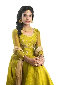 Saree Prints: Portrait of beautiful traditional Indian girl posing on white background
