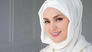 Timid Prints: Portrait of beautiful young muslim arabian woman wearing white hijab