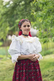 Villager Prints: Portrait of a beautiful young woman wearing traditional Romanian clothes, in Maramures