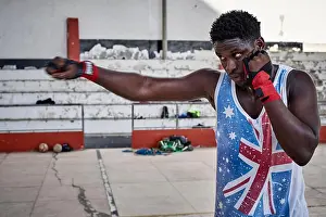 Sweat Prints: Portrait of boxer practicing