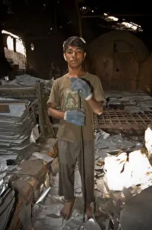 Dhaka Prints: Portrait of boy in Dhaka metal turning factory