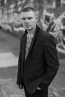 Threat Prints: Portrait of a bully man in a jacket. Black and white photo
