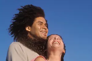 30 Years Prints: portrait of couple laughing 34 yr old mixed African Caucasian male and 27 yr old Caucasian female