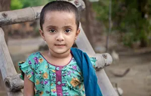 Young Girl Prints: Portrait of cute Indian girl in floral green dress with blue scarf