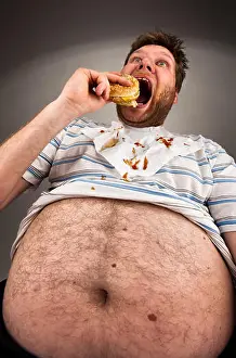 Unshaven Prints: Portrait of expressive fat man eating burger