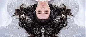 portrait face half mirrored of a young woman with dark brown hair