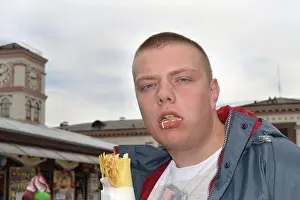 Fastfood Prints: Portrait of a funny guy who eats shawarma with great pleasure