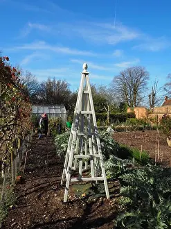 Portrait of gardener preparing the patch in Chenies Manor Kitchen garden in Spring