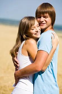 Passionate Prints: Portrait of girlfriend and boyfriend hugging each other