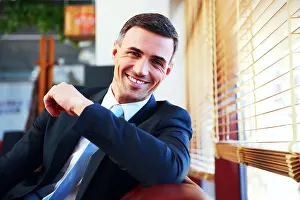 Formalwear Prints: Portrait of a handsome happy businessman in suit