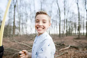 Practicing Prints: Portrait of happy boy holding bow