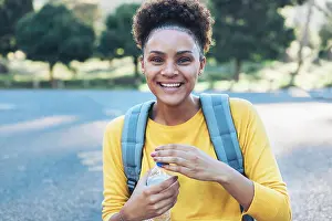 Weekend Activities Prints: Portrait happy, confident young woman with water bottle