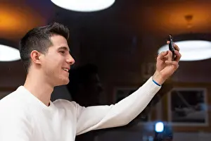 Cafeteria Prints: Portrait of Happy young man taking selfie at the coffee shop