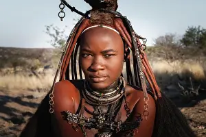 Namib Prints: Portrait of a Himba woman dressed in traditional style in Namibia, Africa