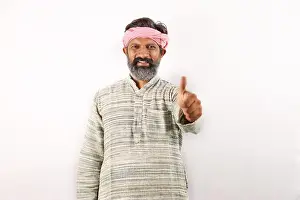 Villager Prints: Portrait of Indian bearded man in rural India concept