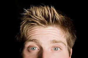 Blond Hair Prints: Portrait of a man with blue eyes and spiky hair on a black background; Edmonton