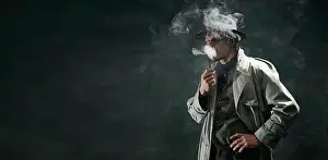 Evidence Prints: Portrait of man, detective in trench coat and hat smoking pipe over vintage dark green background