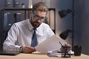 Necktie Prints: Portrait of Mature Company CEO at Work