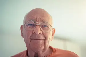 Reality Prints: Portrait of older senior man in orange shirt in natural light