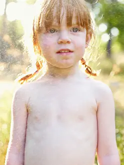 Redhead Prints: Portrait of shirtless girl sprinkled with water
