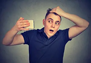 Bald Prints: Portrait shocked man feeling head