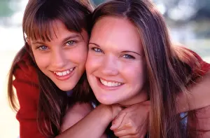 Portrait of sisters hugging