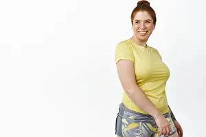 Redhead Prints: Portrait of smiling redhead woman plus size doing sport activities