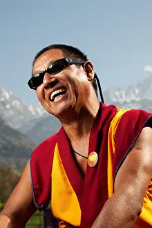 Lama Prints: Portrait of a smiling Tibetan Buddhist monk with sunglasses in Dharamsala, India