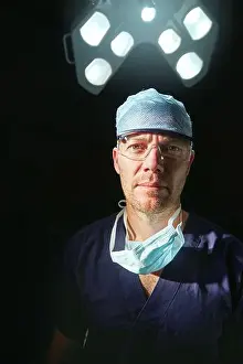 Scrubs Prints: Portrait, surgeon and man with surgical lights