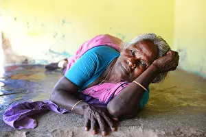 Tamil Nadu Prints: Portrait of a Tamil woman resting at her home in Koovagam village in Tamil Nadu, India