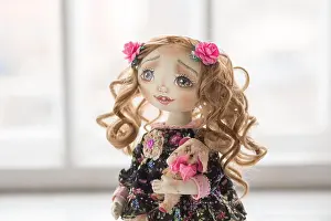 Embroidery Prints: Portrait of textile handmade vintage doll with green eyes