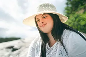 Childcare Prints: Portrait of trisomy adult outside having fun