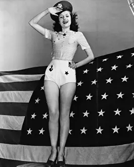 Nostalgic Prints: Portrait of woman saluting with American flag