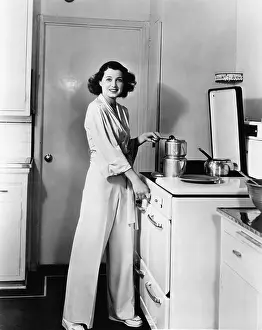 Testimonial Prints: Portrait of woman at stove in kitchen