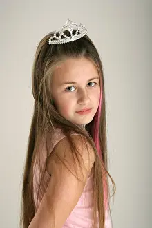 Looking At Camera Prints: Portrait of a ten year old girl wearing a tiara