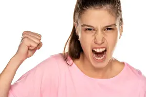 Human Face Prints: Portrait of young angry woman without makeup on white background