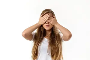 Eyed Prints: Portrait of young beautiful woman closes her eyes with hand on white background