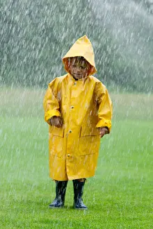 Years Prints: portrait of young boy wearing yellow raincoat