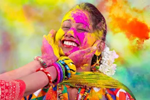 Indian Woman Prints: Portrait of young Indian Woman celebrating Holi color festival