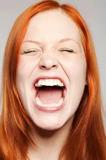 Lengths Prints: Portrait of a young, screaming red-haired woman