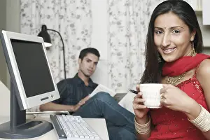 Toothy Smile Prints: Portrait of a young woman holding a cup