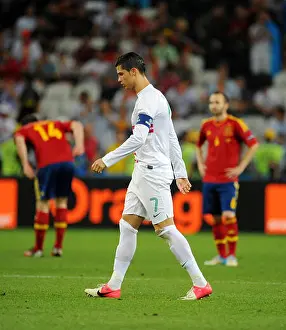 Sports Soccer Prints: Portugal's Cristiano Ronaldo walks on the pitch during UEFA EURO 2012 semi-final soccer match Portugal vs Spain