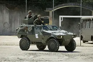Camouflaged Prints: Portuguese Panhard military armored vehicle with two soldiers