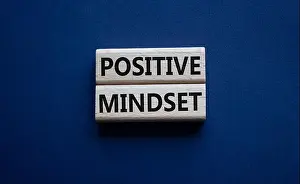Optimistic Prints: Positive Mindset symbol. Concept words Positive Mindset on wooden blocks