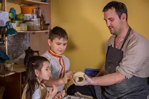 Shaping Prints: Potter showing how to work with ceramic in pottery studio