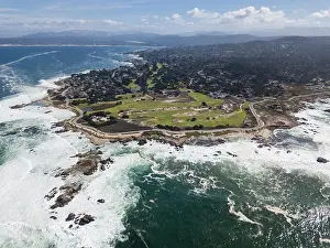 Powerful swells from the Pacific Ocean wash against the scenic coastline of the Monterey peninsula in California