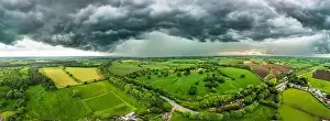 Cinematic Prints: A powerful thunderstorm looms over expansive green fields in North Yorkshire