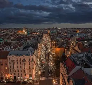 Prague, Czech Republic - Aerial drone view of Christmas decorated street in Prague at dusk